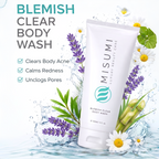 MISUMI Blemish Clear Body Wash (120ml) tube surrounded by fresh flowers highlighting the calming botanicals.